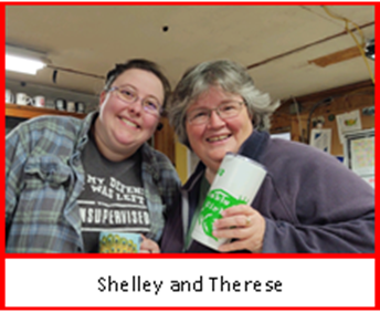 Shelley and Terese are smiling.