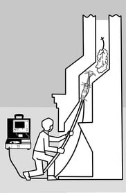 A man is inspecting a fireplace chimney with a chimney camera.  a fireplace. A video cable is attached to a unit with controls and a monitor which records videos and images.